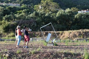Exhibition's visitors taking photos of the "Untitled" sculpture by George Zongolopoulos