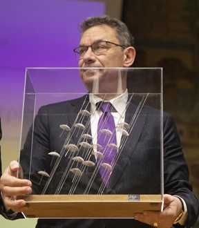 The President of Pfizer Albert Bourla with the famous "Umbrellas" of George Zongolopoulos